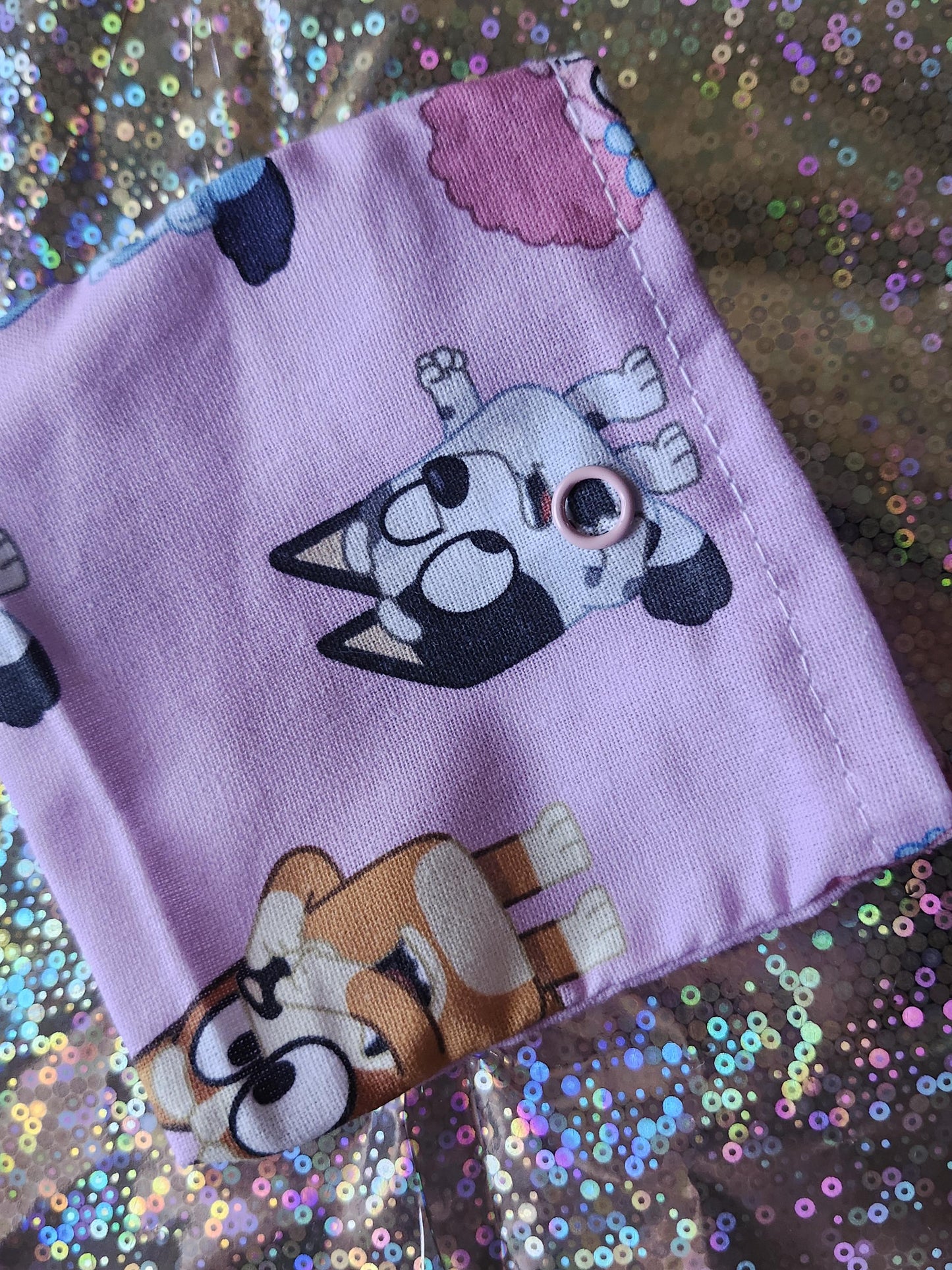 Colorful Bluey trinket pouch gift featuring cartoon characters on a pink background