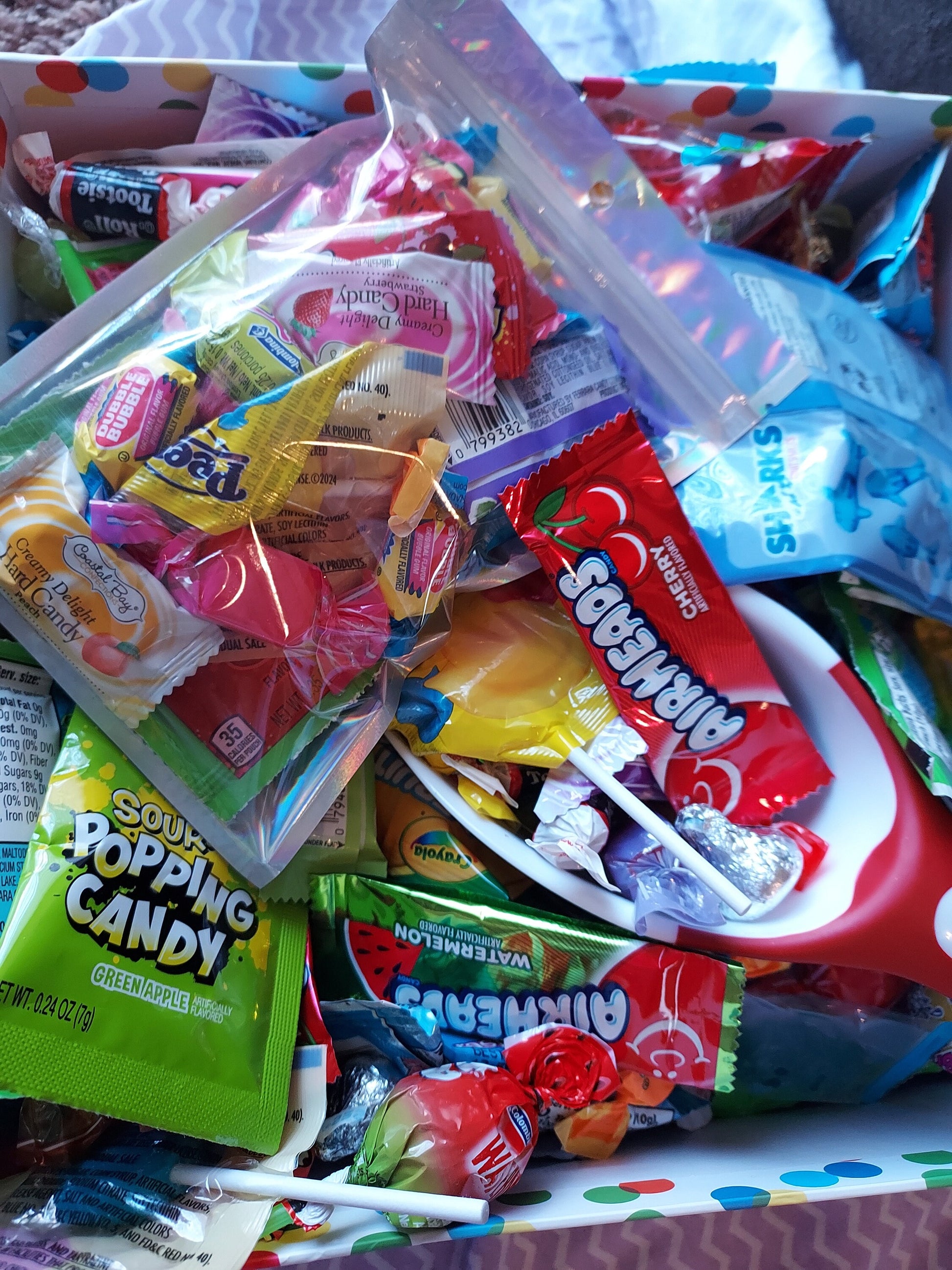 Colorful assortment of Candy Mystery Scoops including various candy bags and treats