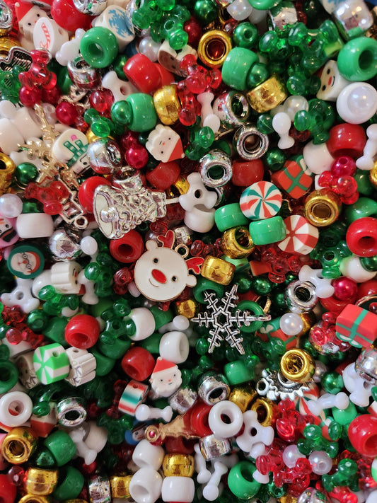 Colorful Christmas bead mix featuring red, green, and white beads with festive designs and charms