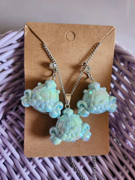Cinderella themed earrings and necklace set featuring iridescent blue designs on a display card