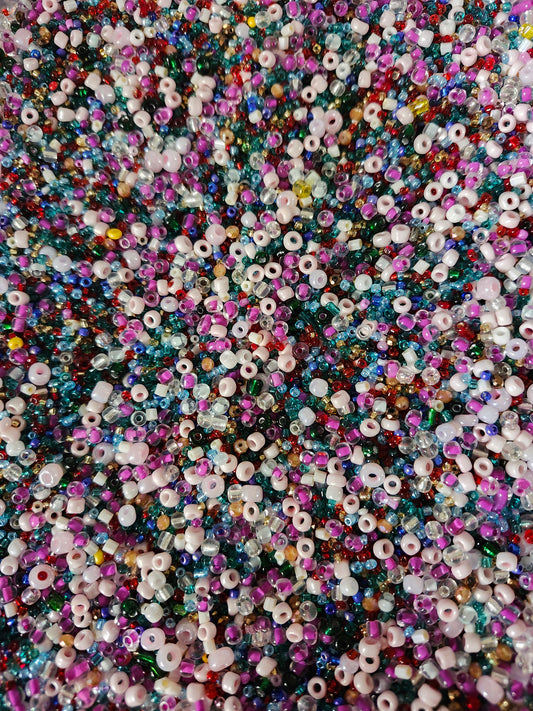 Vibrant assortment of colorful glass seed beads in various sizes and hues for crafting and jewelry making
