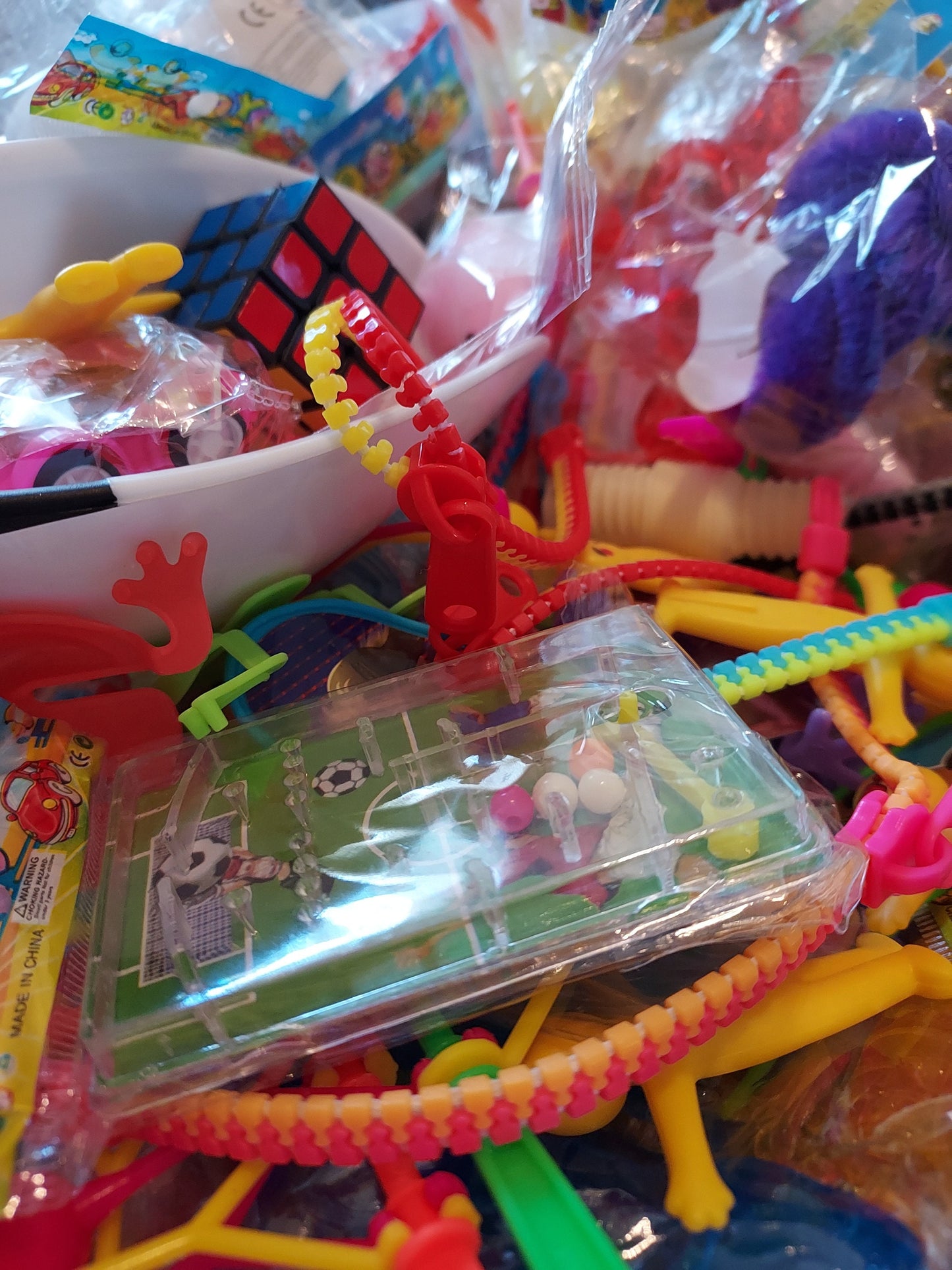 Colorful assortment of fidget toys in a mystery grab bag, including mini figures and sensory items
