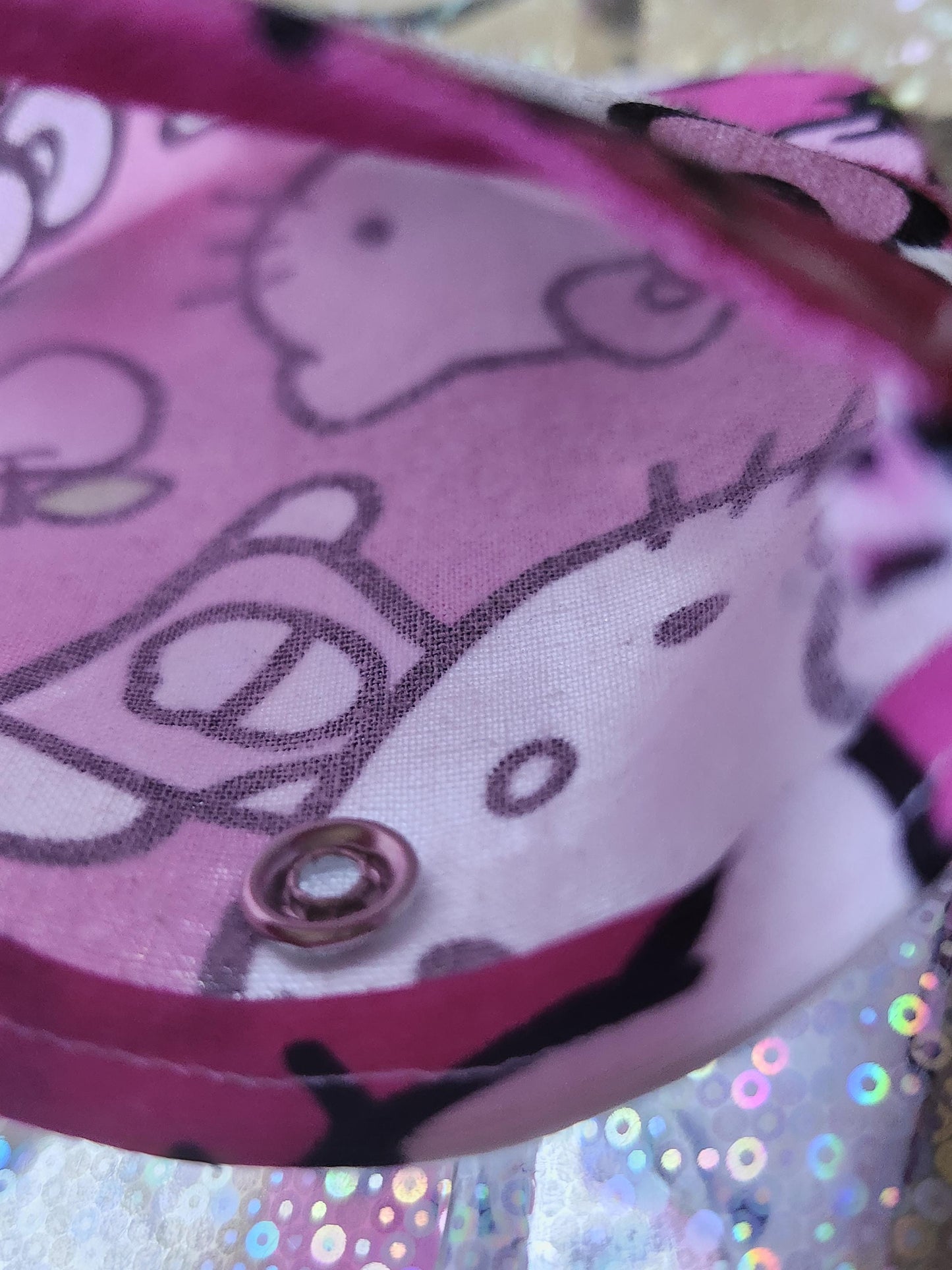 Inside view of a Hello Kitty kawaii pouch with pink fabric featuring the iconic character's pattern