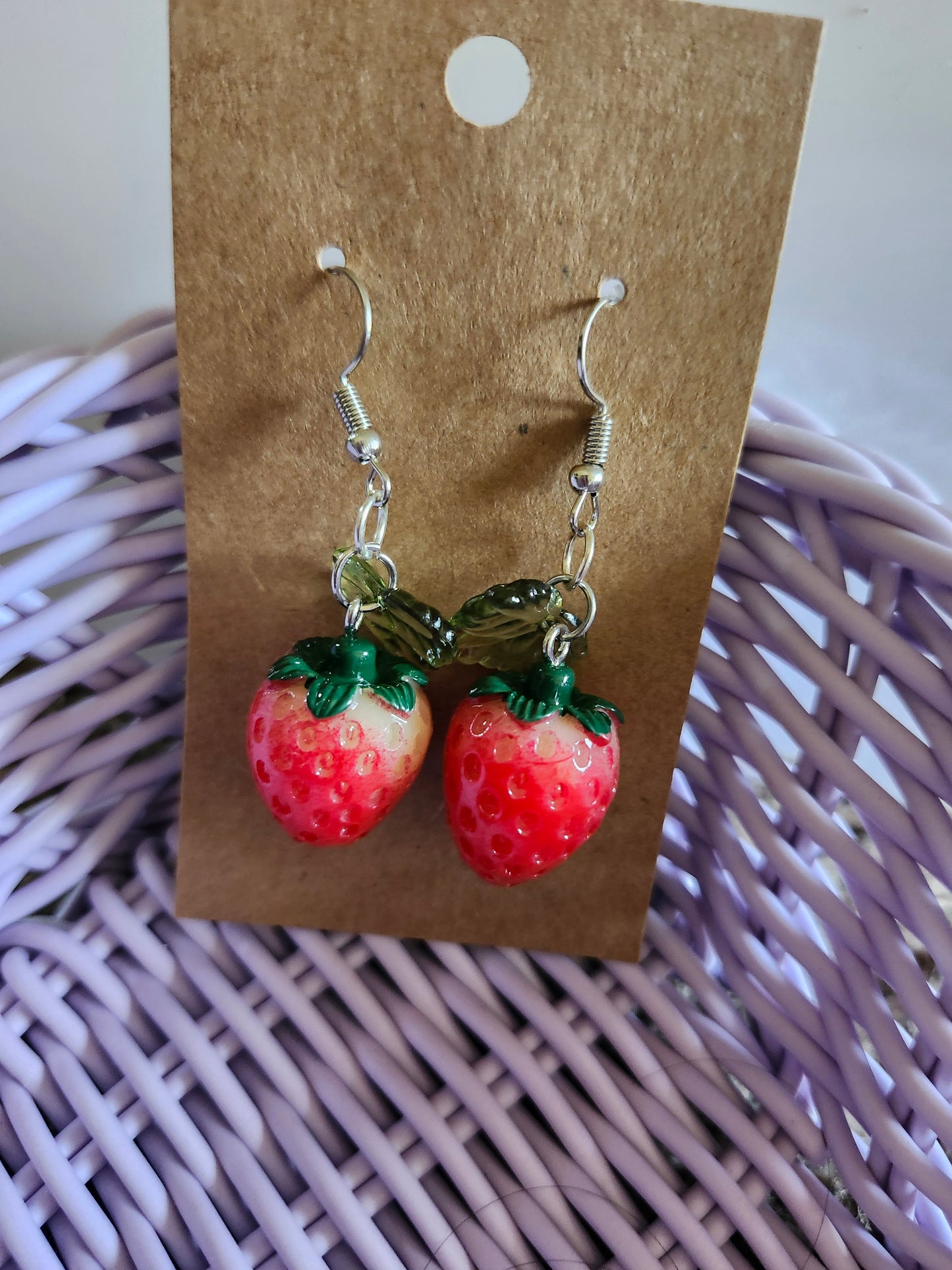 Kawaii strawberry earrings in red with green leaves, perfect for cute accessory lovers