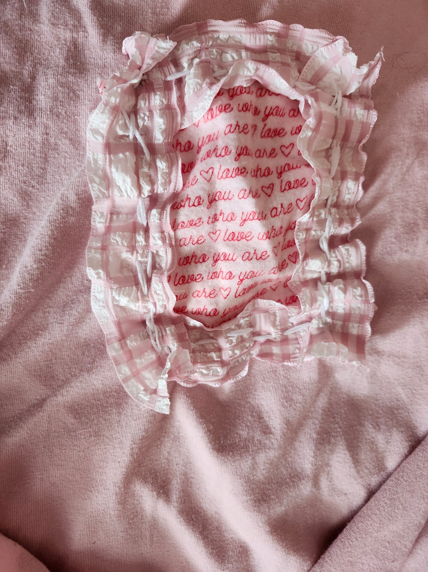 Pink spank-kei style clothing with ruffled edges and heart pattern lining for a playful aesthetic