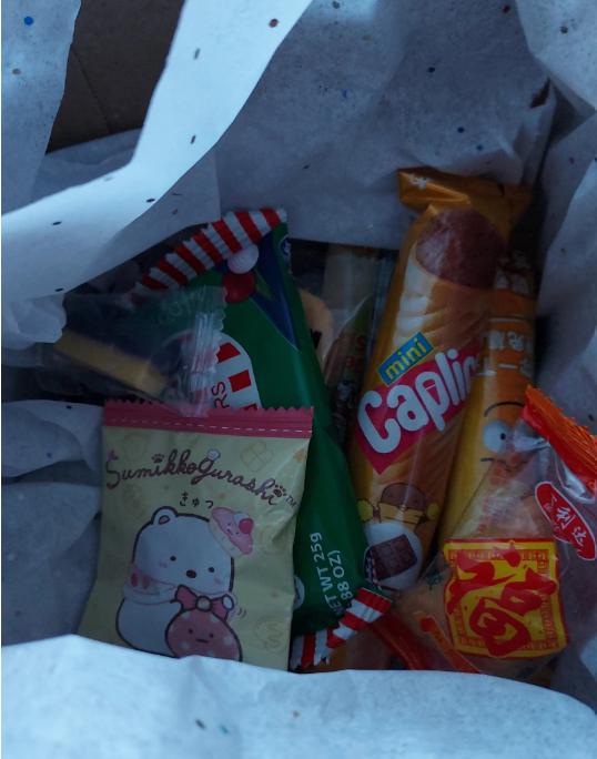 Asian snack box gift filled with assorted snacks including candies and chips