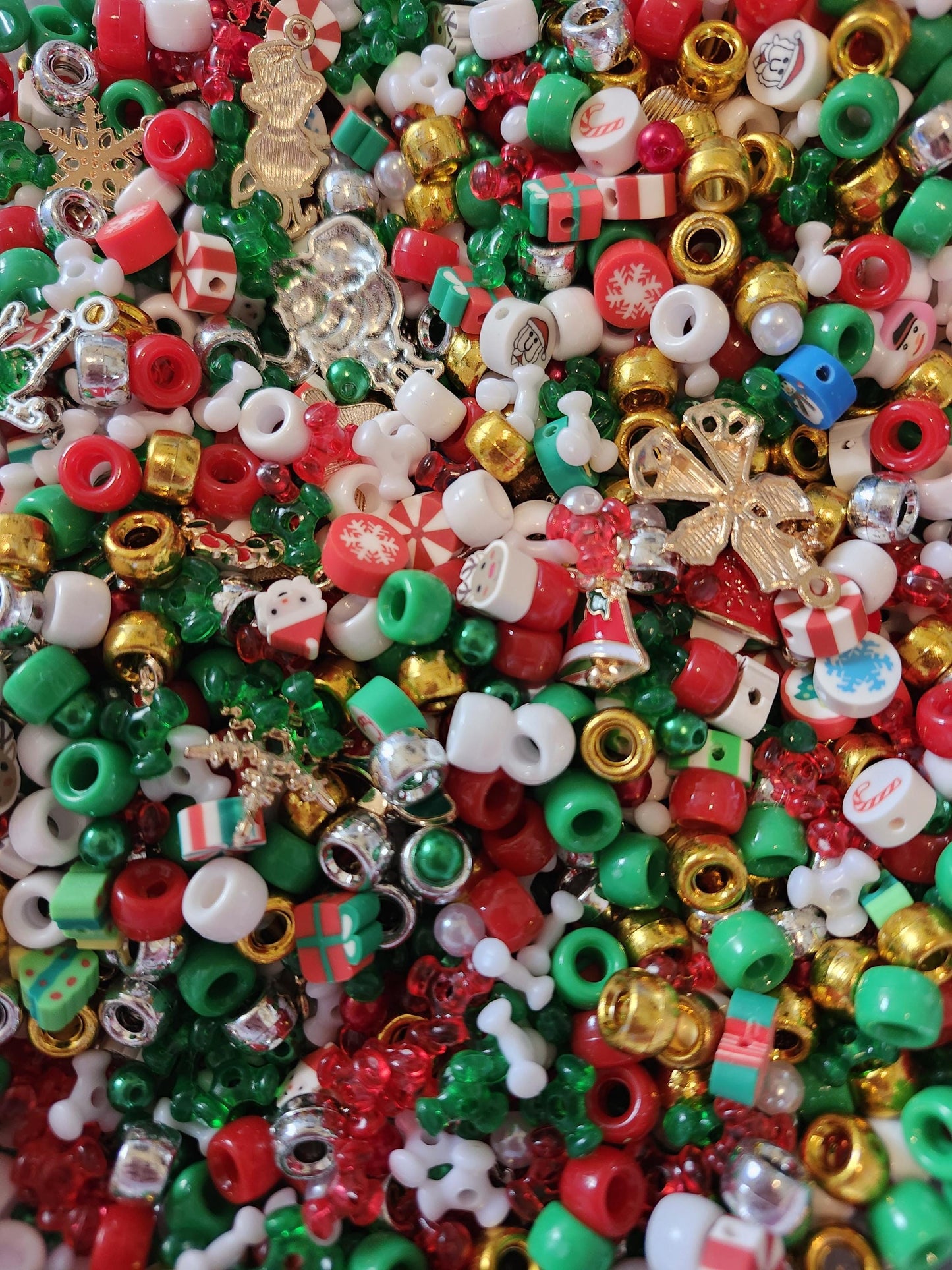 Colorful Christmas bead mix featuring red, green, and gold beads for holiday crafting and decorations