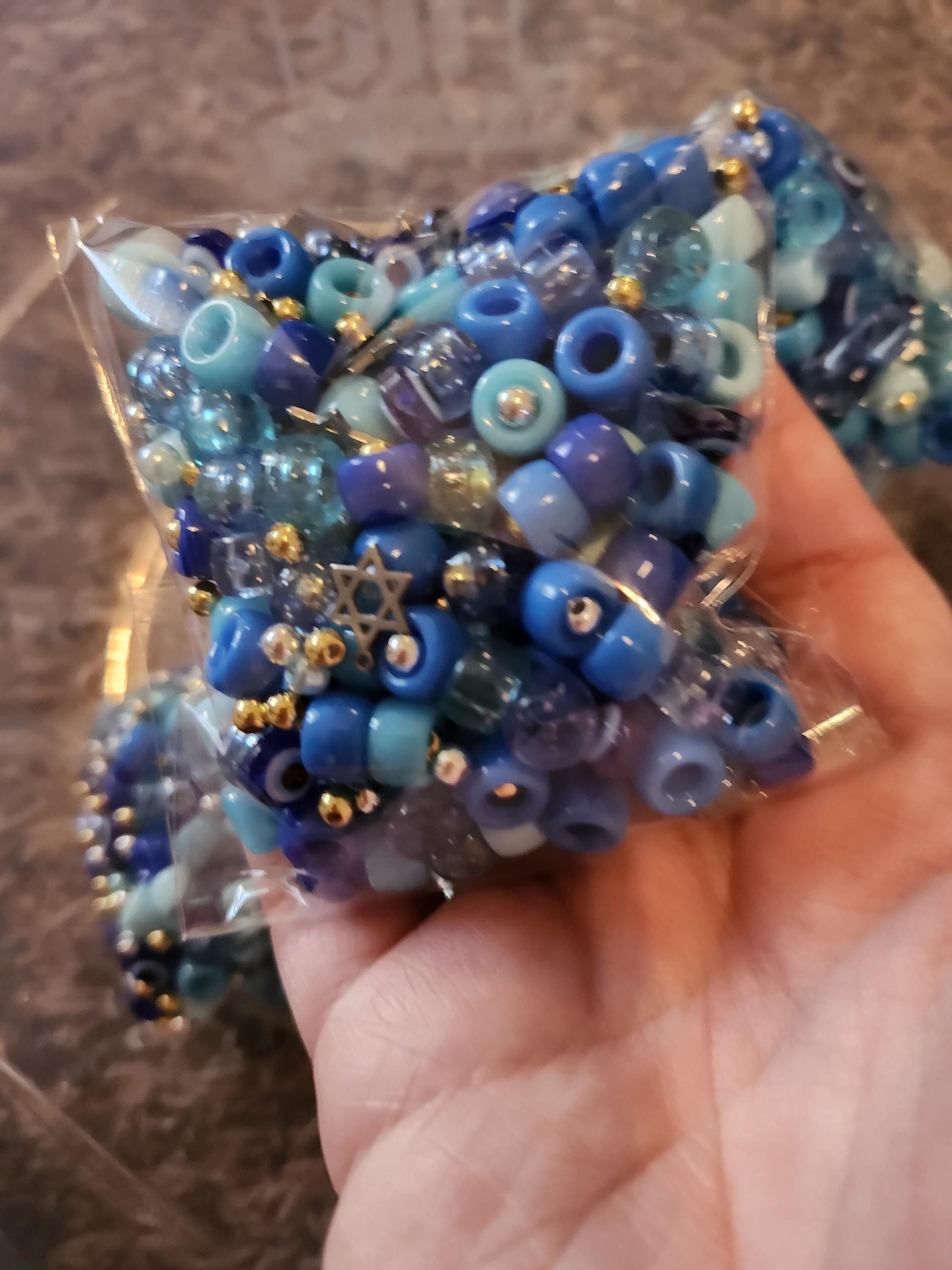 Colorful Hanukkah jewelry making kit with blue beads and gold accents for crafting projects