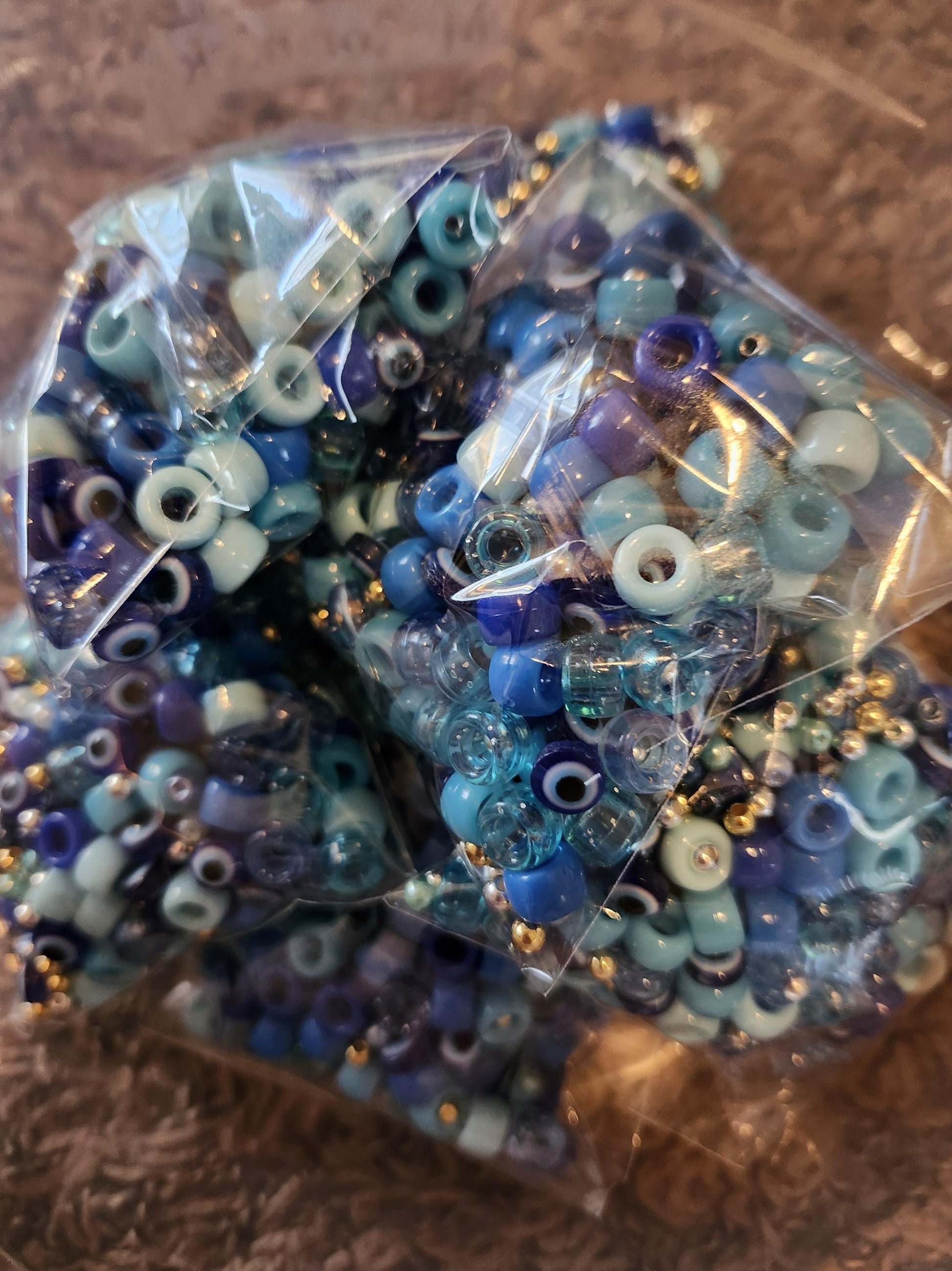 Colorful beads in blue tones packed for the Hanukkah jewelry making kit.