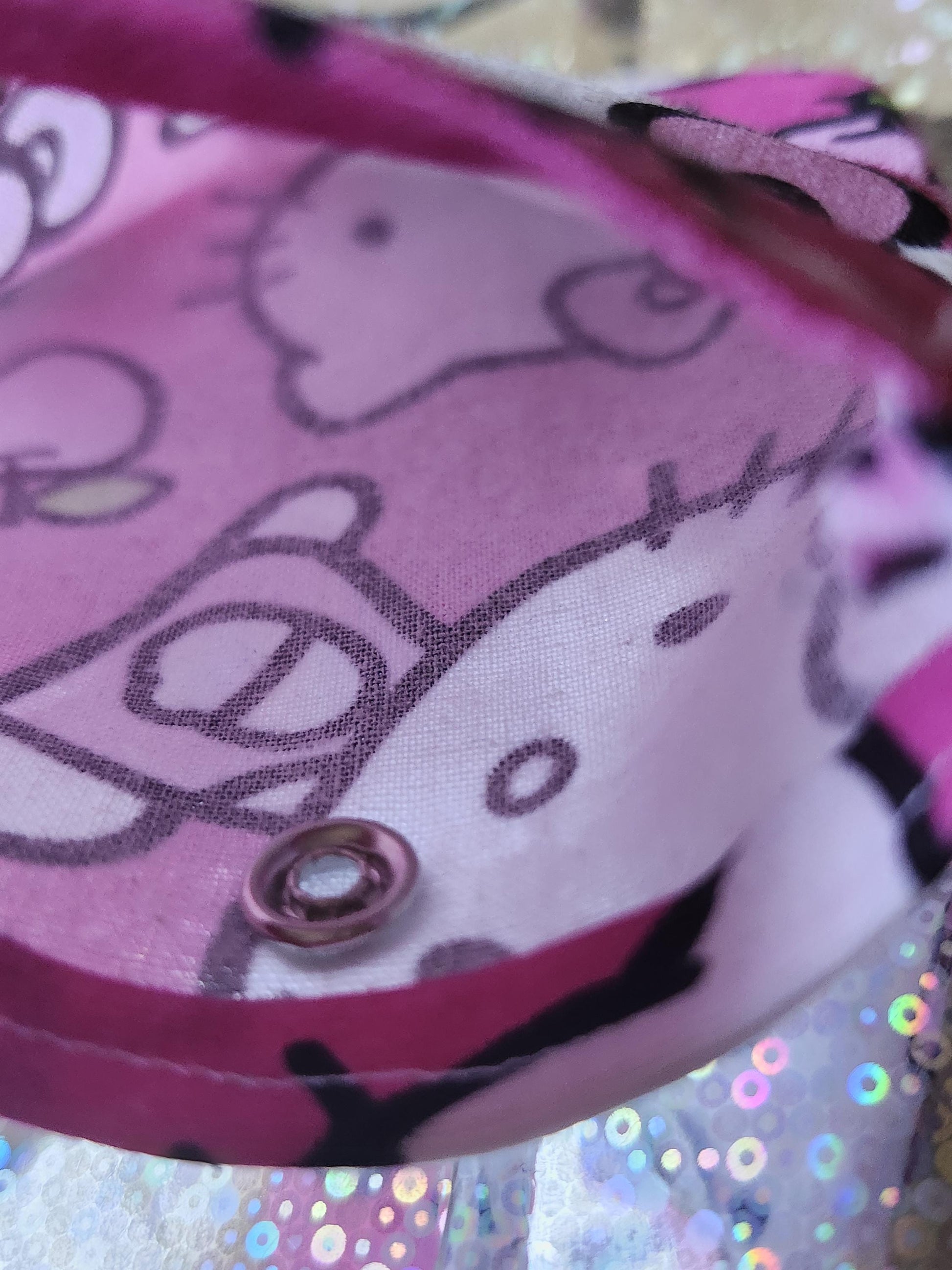 Inside view of a Hello Kitty kawaii pouch with pink fabric featuring the iconic character's pattern