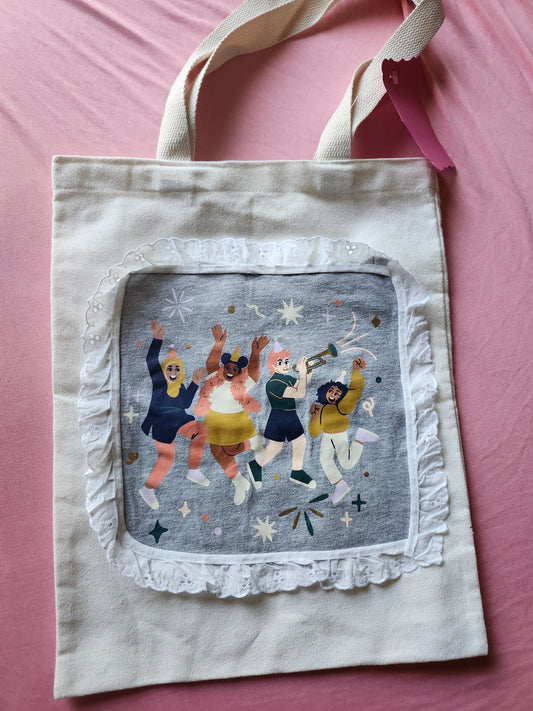 Inclusive design tote bag featuring colorful illustrations of diverse people celebrating joyfully