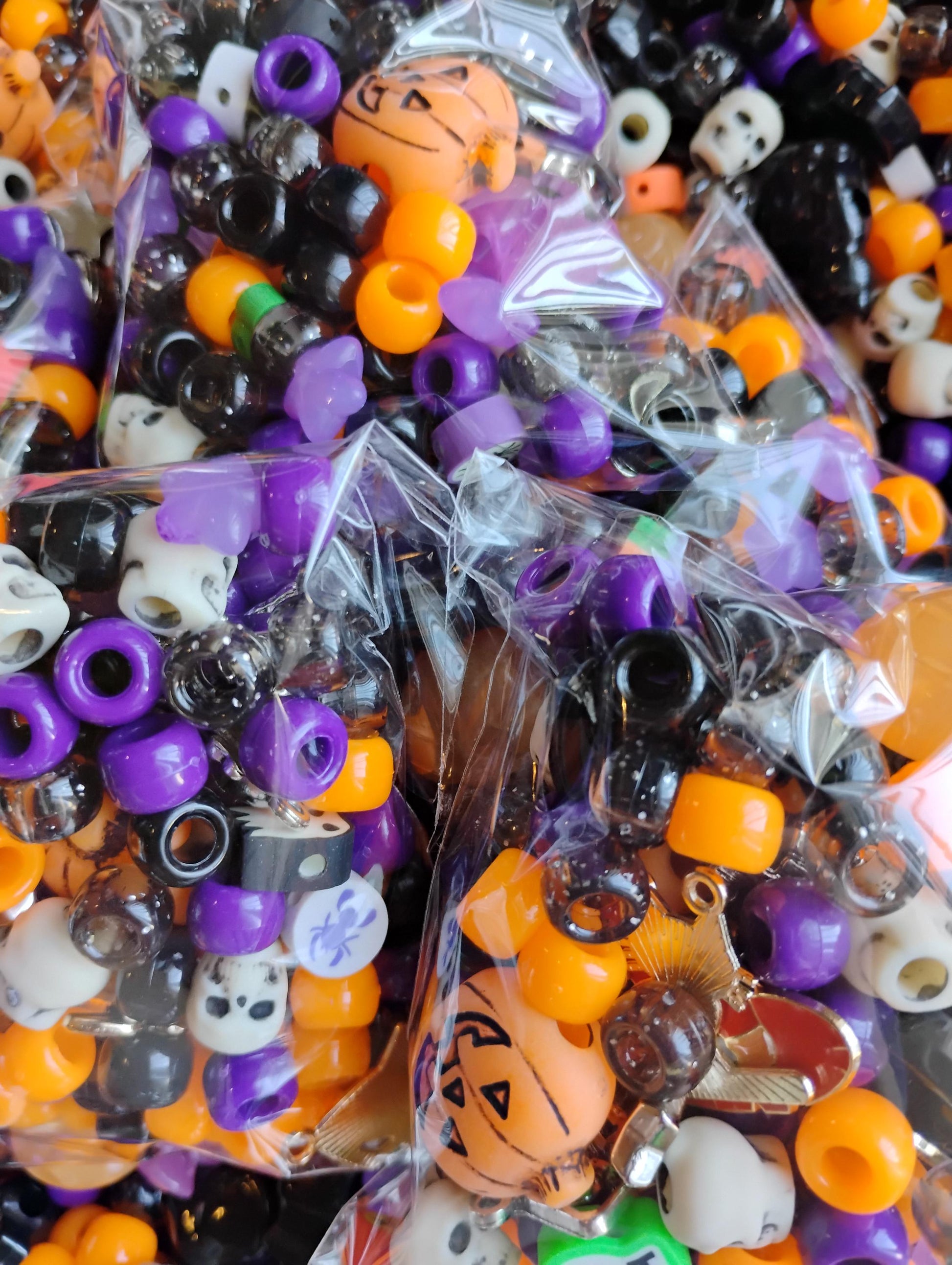 Vibrant assortment of Kandi beads Halloween in purple, orange, and black for festive crafting