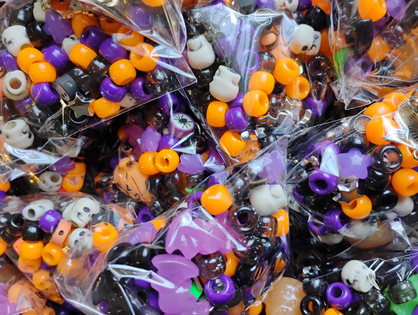 Colorful Kandi beads Halloween assortment in clear bags, featuring spooky designs and vibrant colors