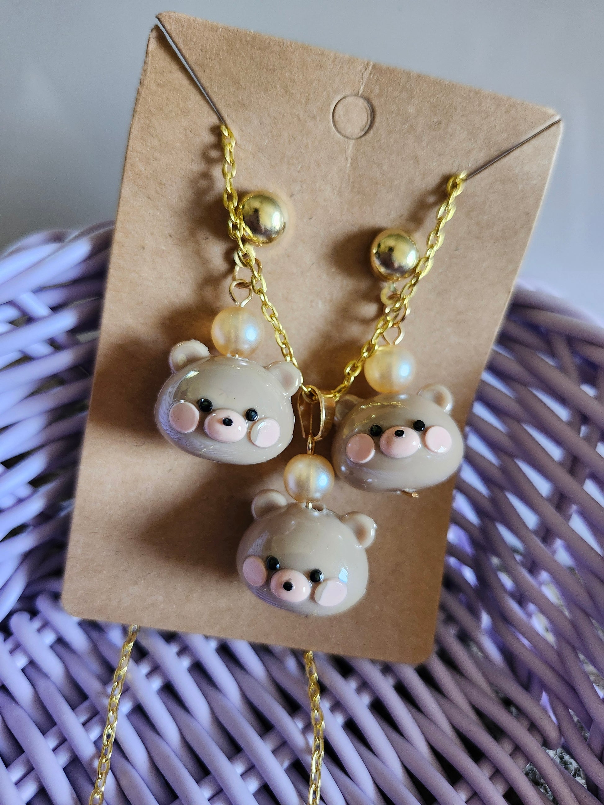 Kawaii bear necklace set featuring three adorable bear pendants with pearl accents on a gold chain