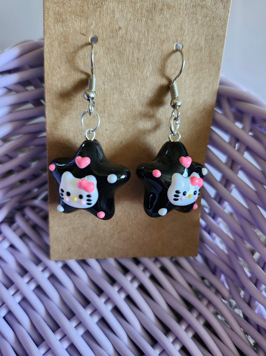 Kawaii Hello Kitty earrings featuring black star design with colorful accents for a cute look