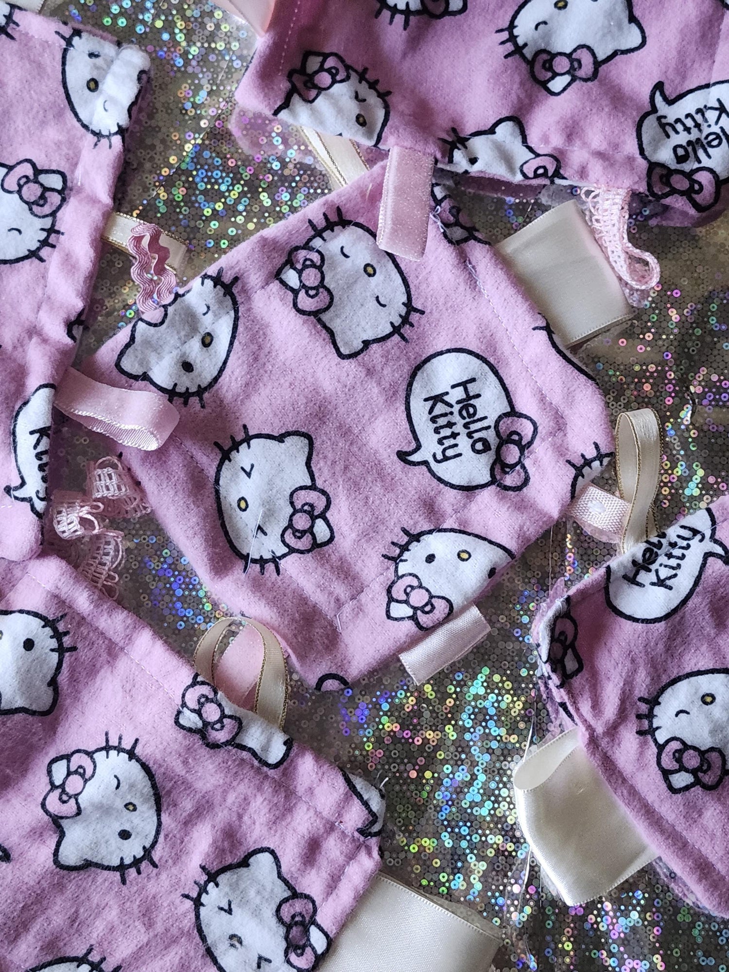 Kawaii Hello Kitty fidget toy with pink fabric featuring Hello Kitty faces and playful designs