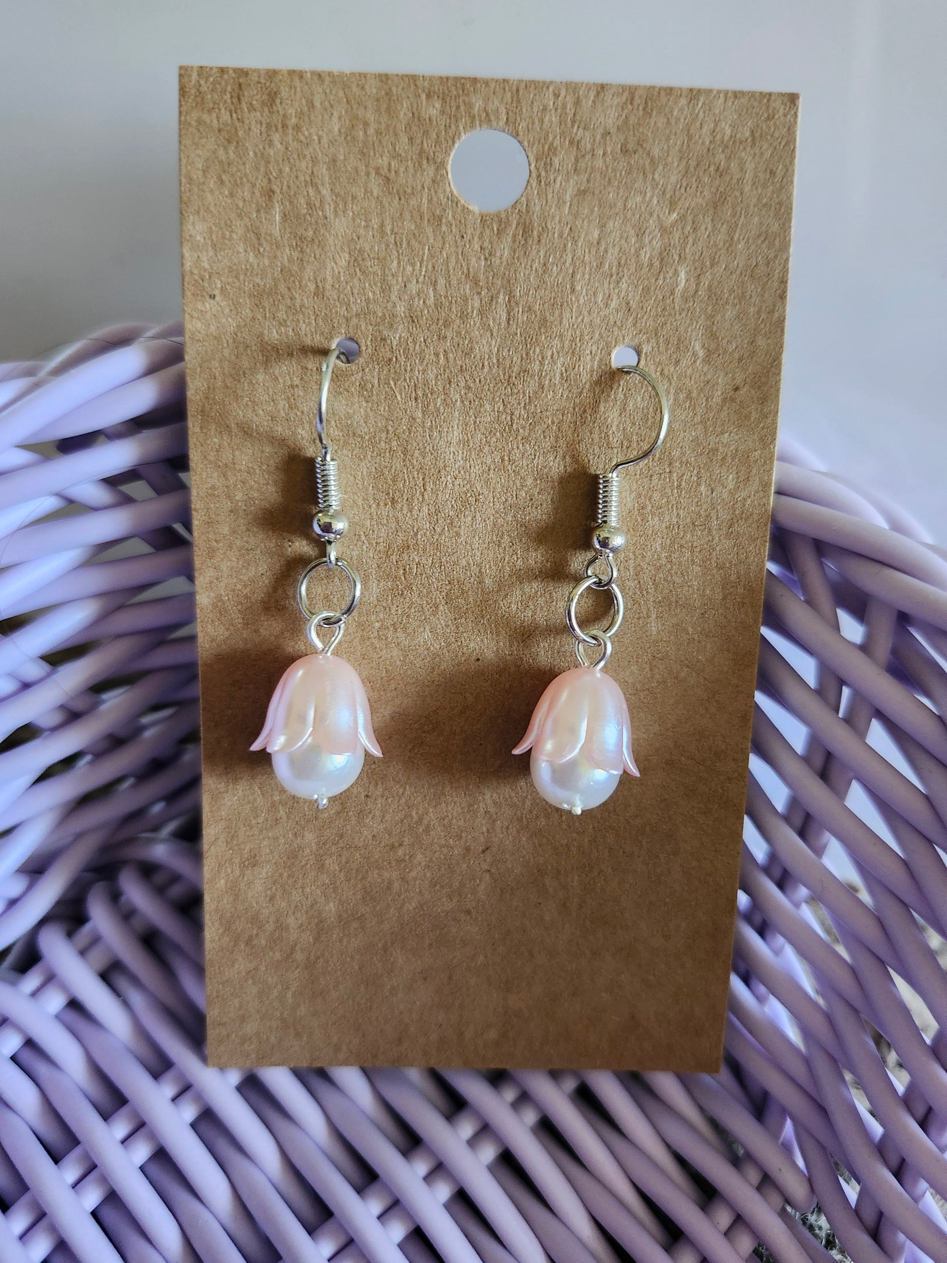 Kawaii pink flower earrings with pearl-like petals on silver hooks for a cute accessory