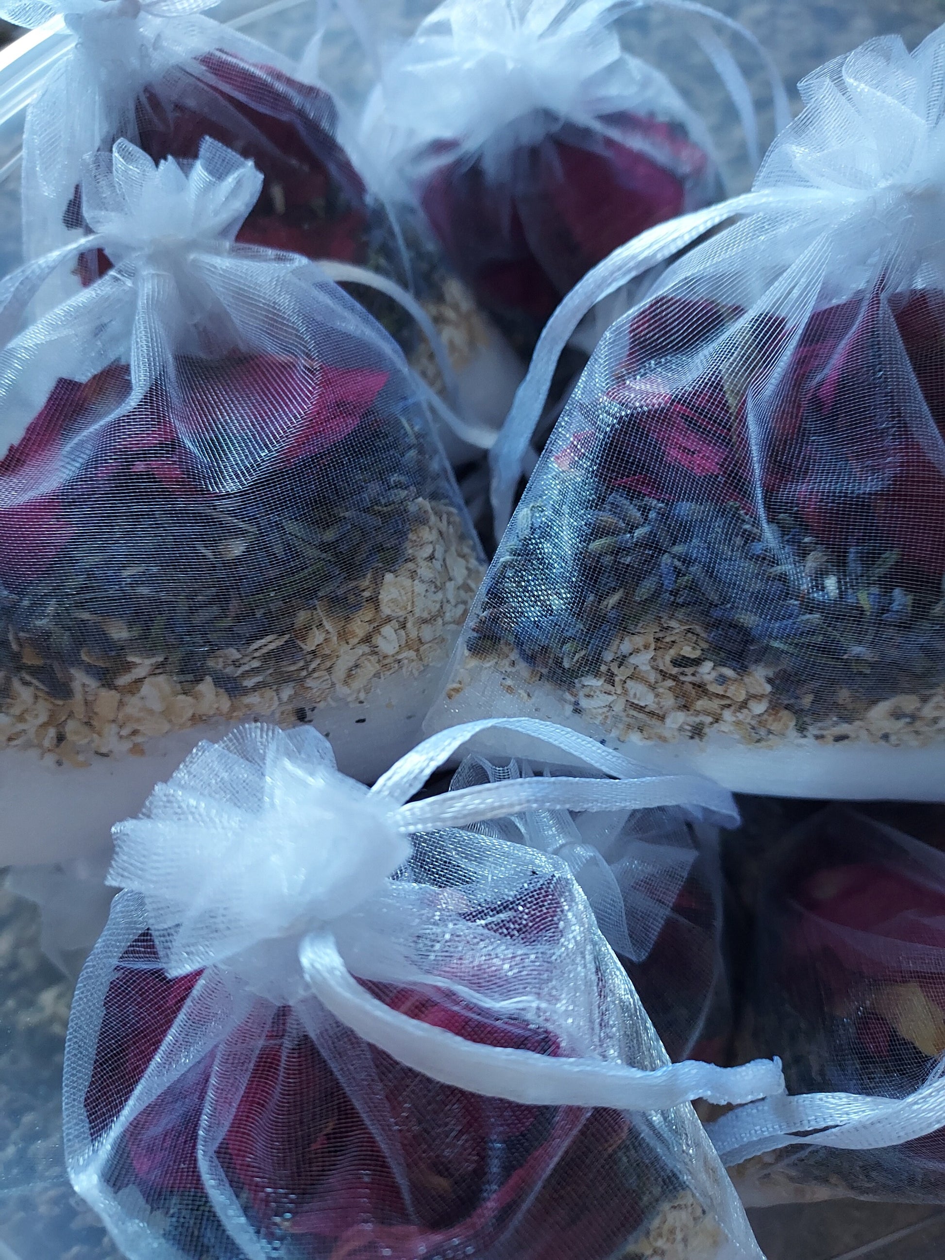 Natural spa bath blend sachets filled with dried flowers, oats, and lavender for a soothing bath experience