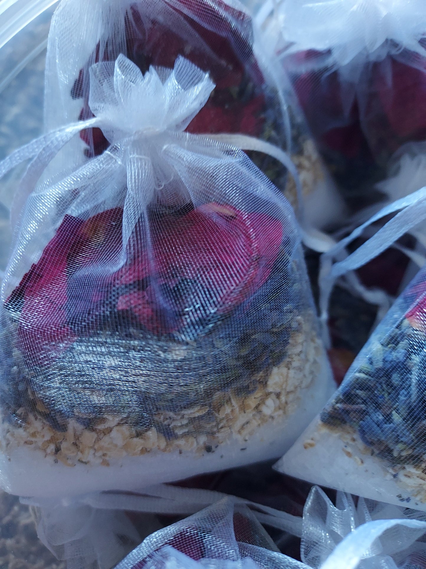 Natural spa bath blend in mesh bags with rose petals, oats, and lavender for a relaxing bath experience