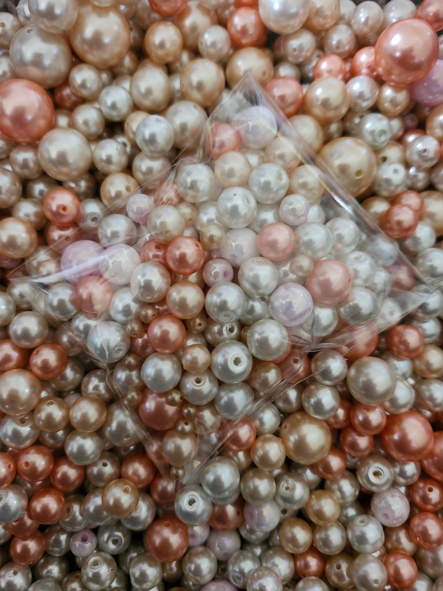 Mixed pink white pearls for jewelry making, perfect for creative designs and crafts