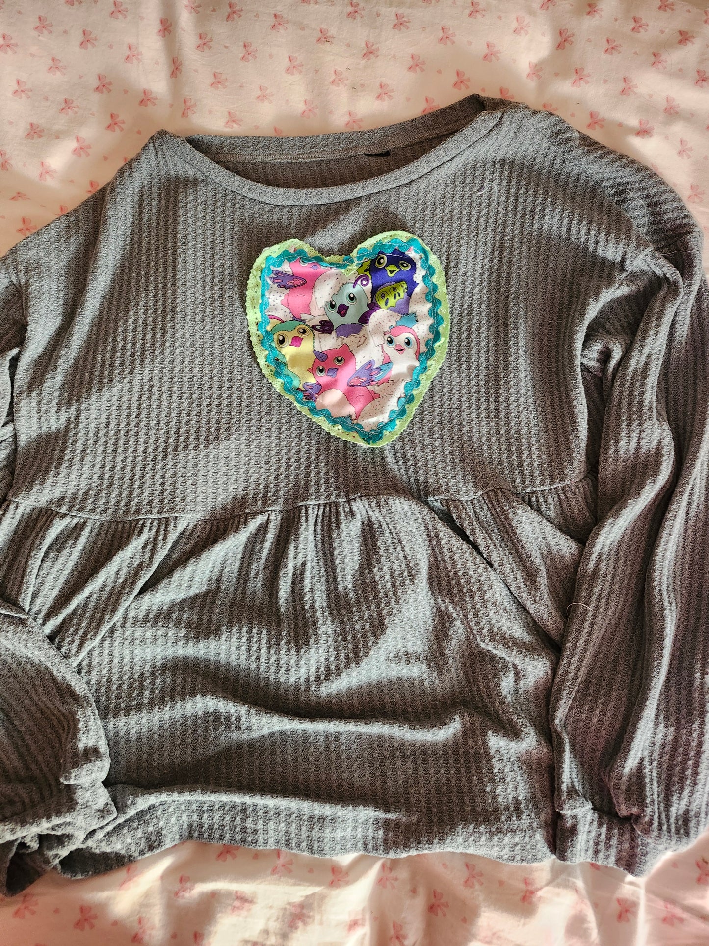 Cozy gray shirt featuring upcycled Furby fashion heart patch design for unique style