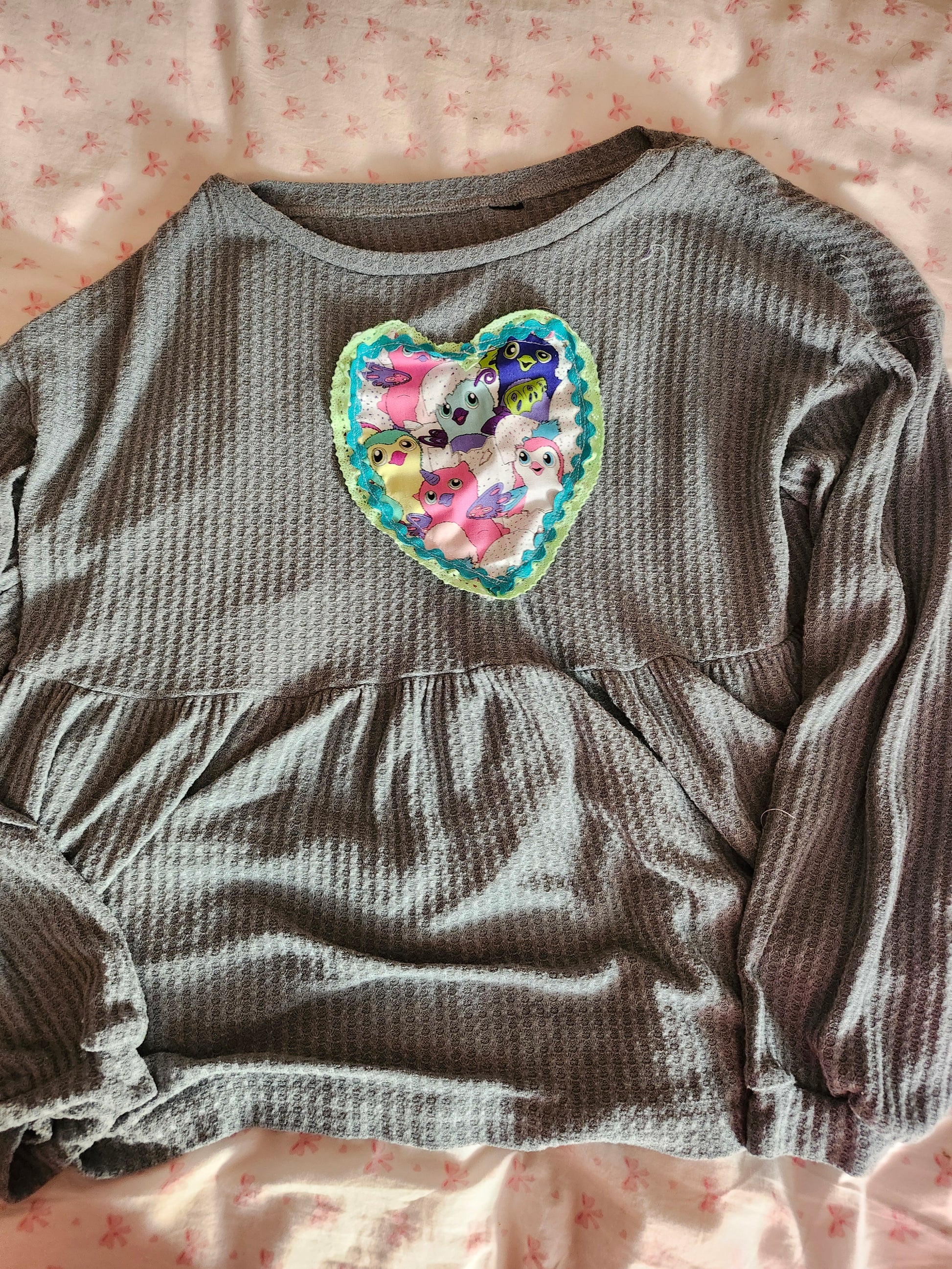Cozy gray shirt featuring upcycled Furby fashion heart patch design for unique style