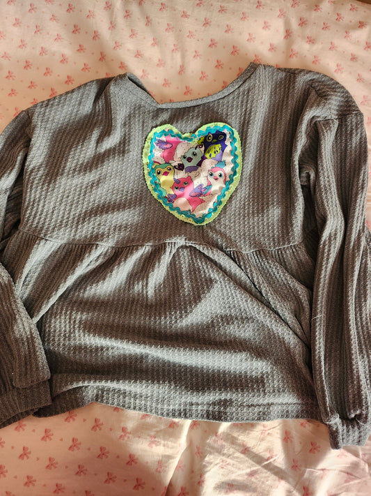 Gray long-sleeve top featuring an upcycled Furby fashion heart patch for a unique style