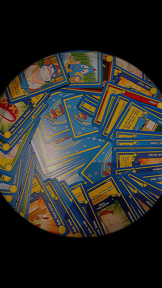 Collection of colorful Webkinz trading cards spread out on a table for kids and collectors