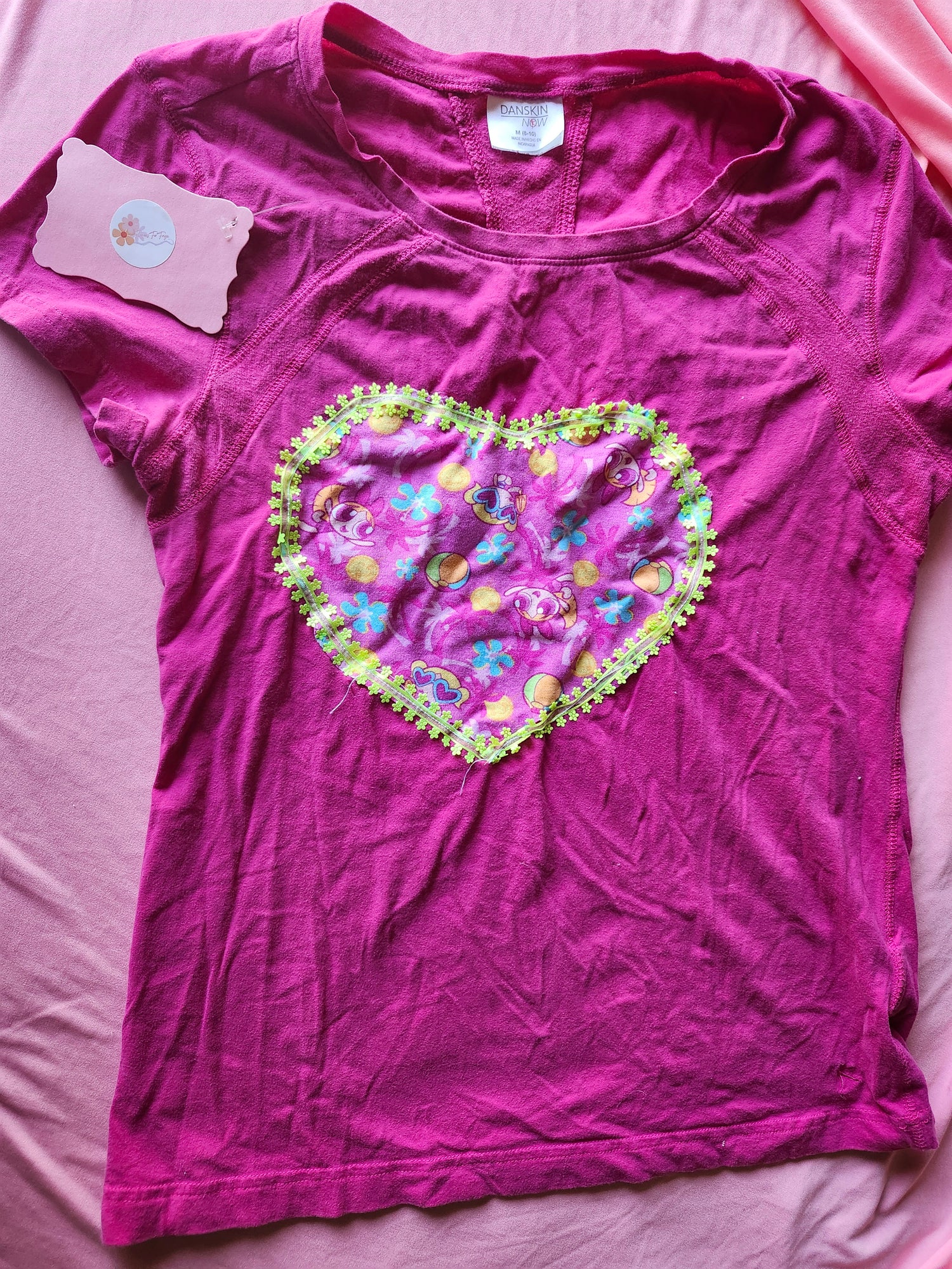 Pink y2k Power Puff Girls T-shirt with a decorative heart design and vibrant floral accents